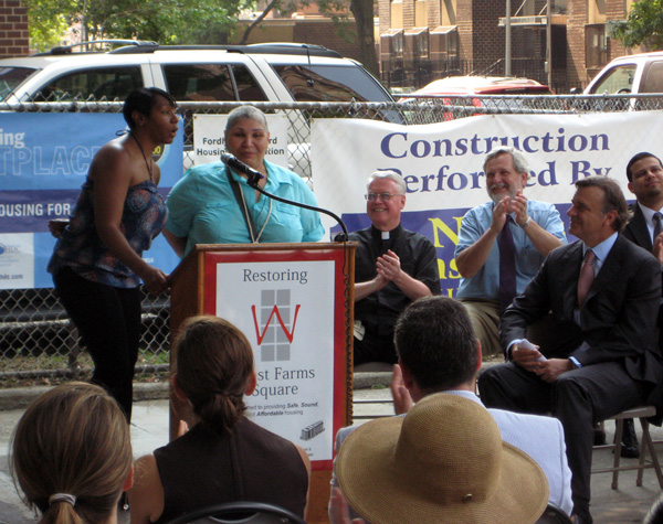West Farms tenants, Anita Walker and Yvonne Adorno, get a round of applause from the officials and developers of the project at the July 20th press conference.
