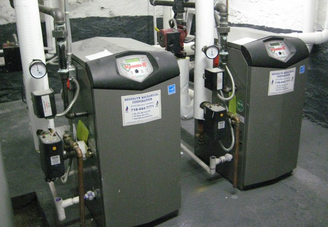 New gas fired high efficiency steam and hot water boilers are installed at 2242 Valentine Ave.