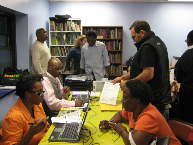 Local Homeowners meet with DEP staff regarding water bills at a UNHP-sponsored resource fair on September 16.