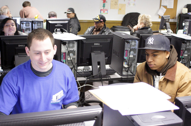 Local residents get free tax preparation assistance from UNHP staff and volunteers including many college students.